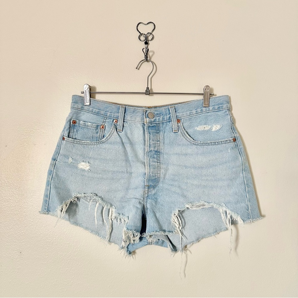 | levi’s • distressed light wash denim hi-rise shorts • size 31 |